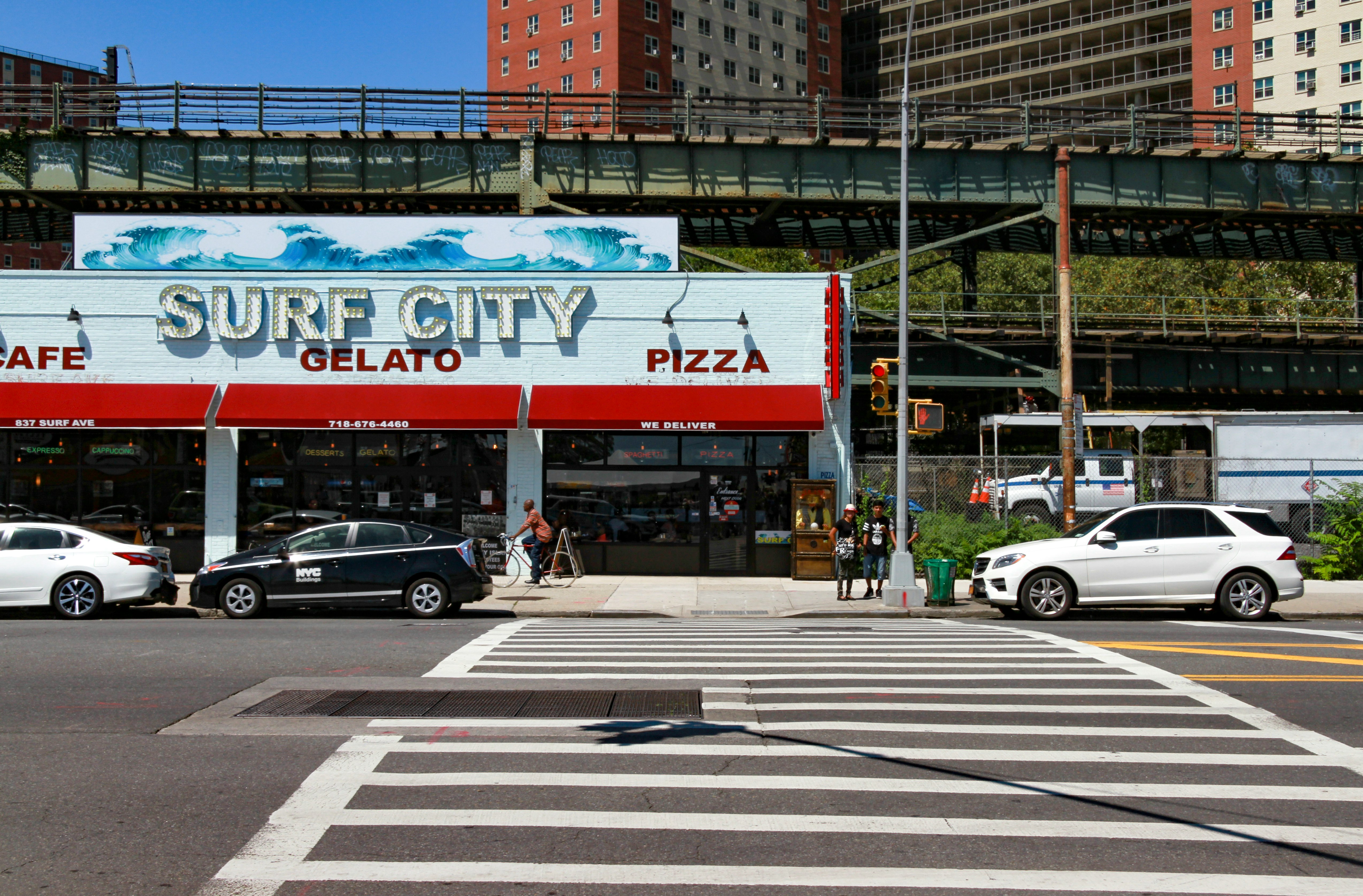 Surf City store beside train tracks and road